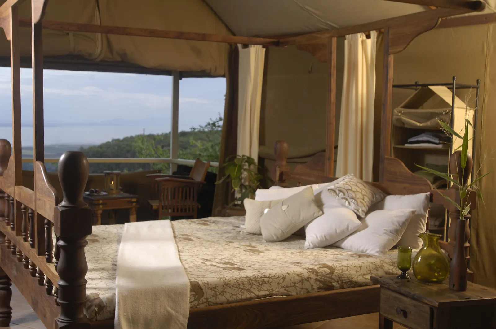 A Manyara tented cottage bedroom with a view over the valley